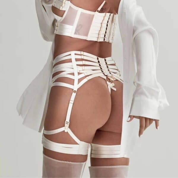 Woman wearing a white Bordelle Signature lingerie set.