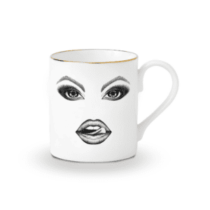 A captivating white porcelain mug, adorned with a precisely drawn monkey in felt. The monkey teases mischievously, running his tongue over his lips. The illustration, done with finesse using a fine-point pen, evokes the Provocateur style and draws its inspiration from Ilona Staller.