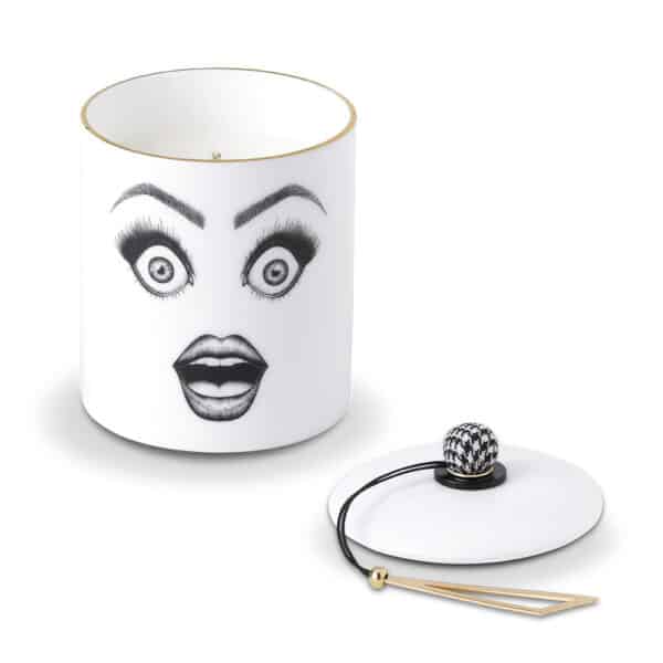 Candle with drawn and surprised face in black and white make-up