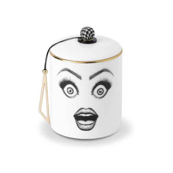 Candle with drawn and surprised face in black and white make-up