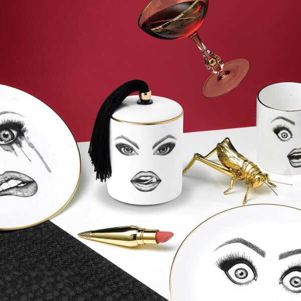 Porcelain candle with seductive make-up face licking her lips