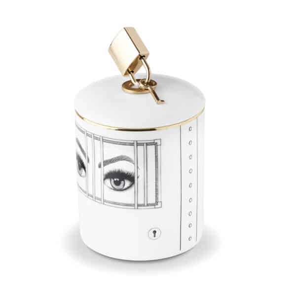 Scented candle with imprisoned eyes drawn in black and white