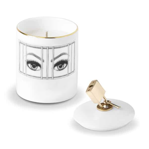 Scented candle with imprisoned eyes drawn in black and white