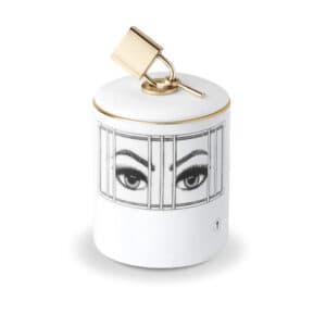 Scented candle with imprisoned eyes drawn in black and white