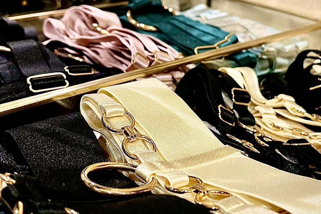 Close-up photograph of garter belts in different colors.