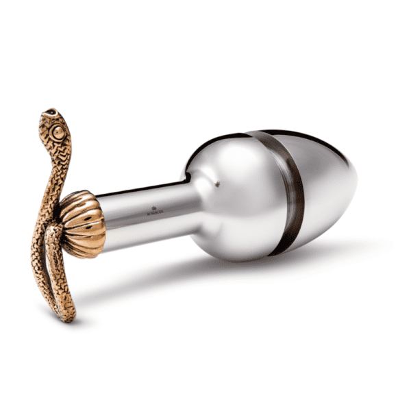 Image on a white background of a silvery plus, it has a copper snake at the end. The plug is open at the center.
