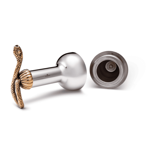 Image on a white background of a silvery plus, it has a copper snake at the end. The plug is open at the center.