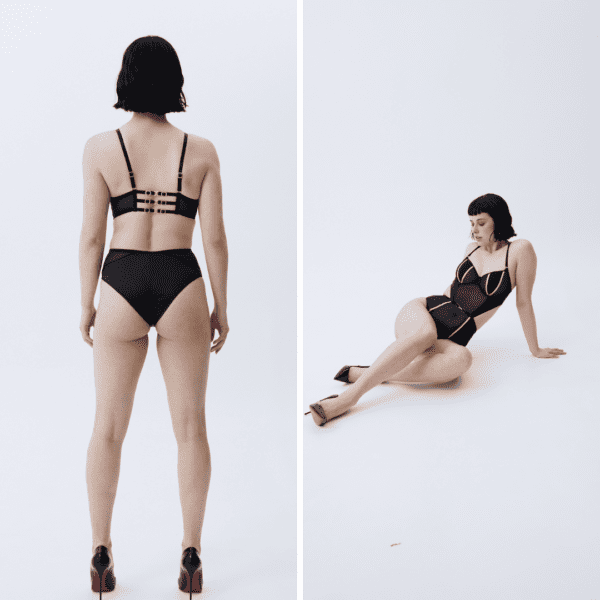 Woman from behind and lying on the ground, wearing the Vixen & Fox Bold bodysuit, with a pair of black escaprins.
