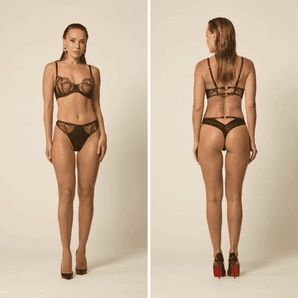 Woman standing front and back wearing Vixen & Fox's Monarchy bra and Monarchy open thong, matched with black pumps. Peacock-inspired collection.