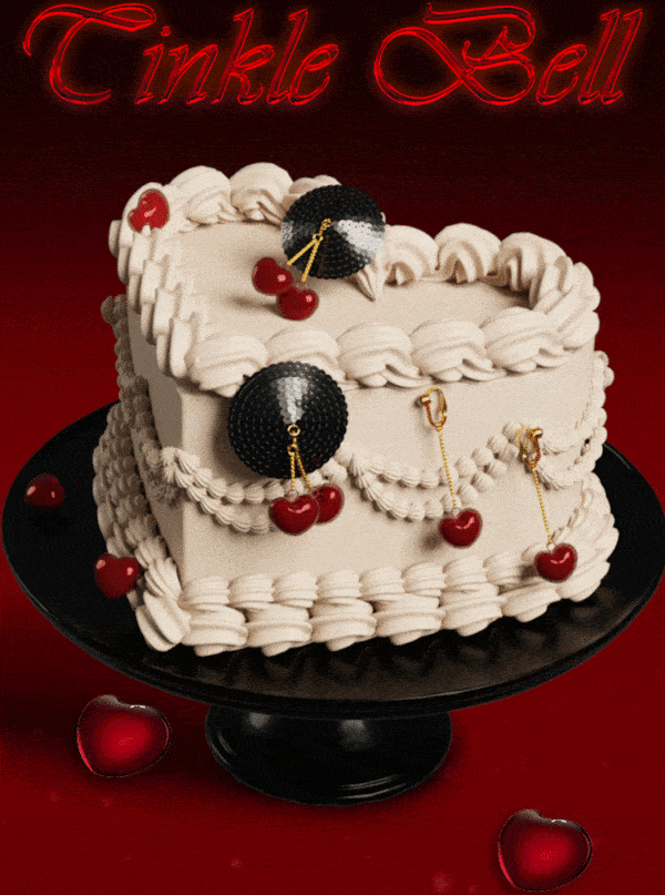 GIF d’un gâteau portant des cache-tétons à clochettes cerise en forme de coeur rouge et chaine et accroche en doré et base en paillettes noires avec les bijoux clitoridiens à clochettes