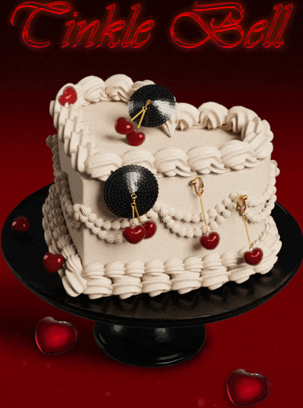 GIF of a cake with red heart-shaped cherry bell covers and gold chain and hook and black sequin base with clitoral bell jewels