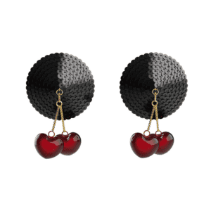 Packshot on white background of nippies with red heart-shaped cherry bells and gold chain and hook and black glitter base