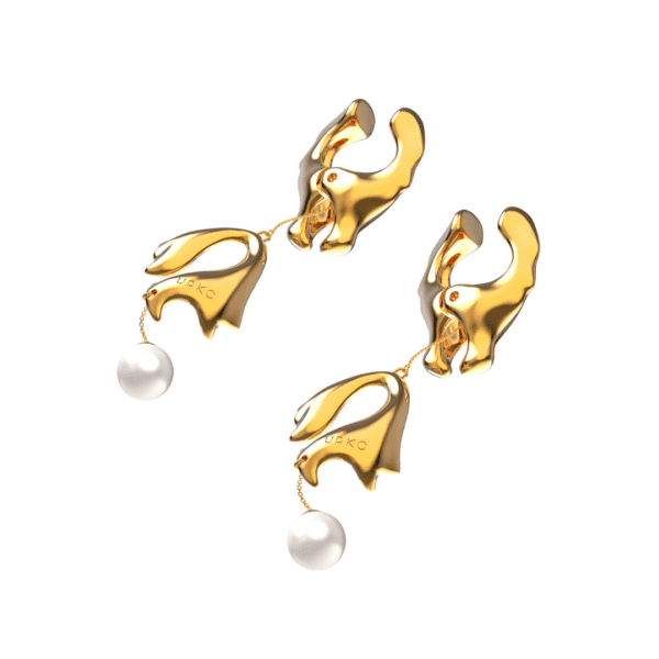 Packshot of golden nipple clamps with pearl on white background