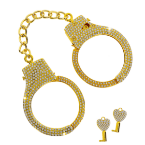 Photo of gold handcuffs with rhinestones.