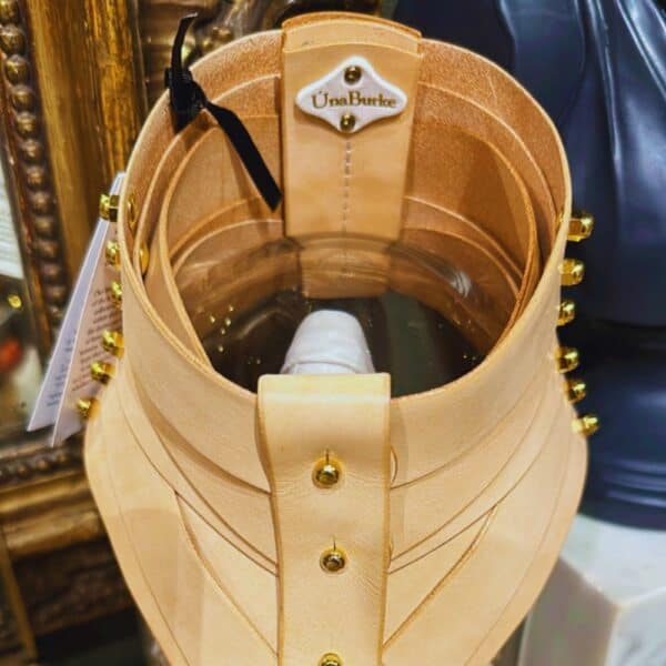 Nude leather collar by Úna Burke, inspired by a medical spine collar, with a bondage rock chic finish. Worn in The Hunger Games - Mockingjay.