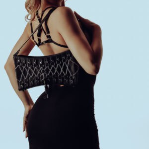 Bamboo convertible dress with removable harness bra, paired with a corseted leather handbag with sterling silver detailing and purple suede interior. Bold, elegant and modular.
