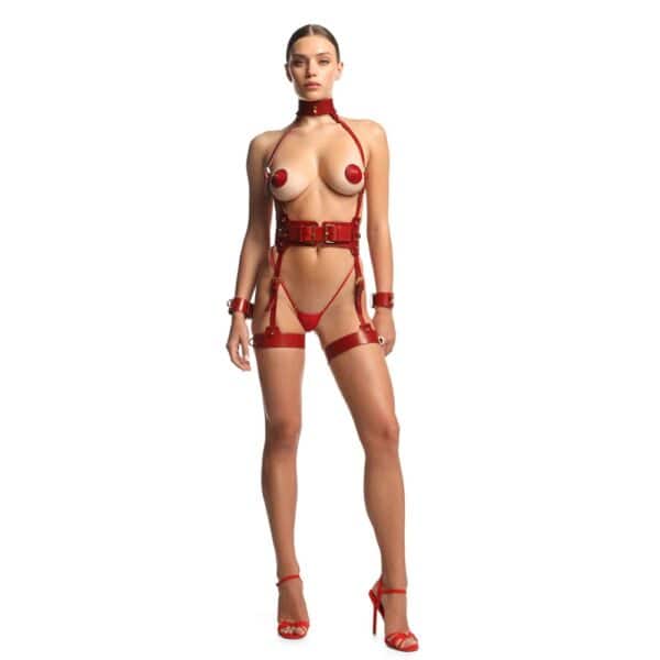 Woman wearing a harness in top-quality red full-grain leather with nickel-plated fittings and details