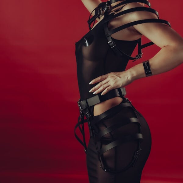 Choker Harness and Belt Harness in 3 mm thick Black vegetable-tanned Italian saddlery leather with avant-garde design, floating shoulder straps and cage-like waist. Wear as a layering piece or with nothing underneath