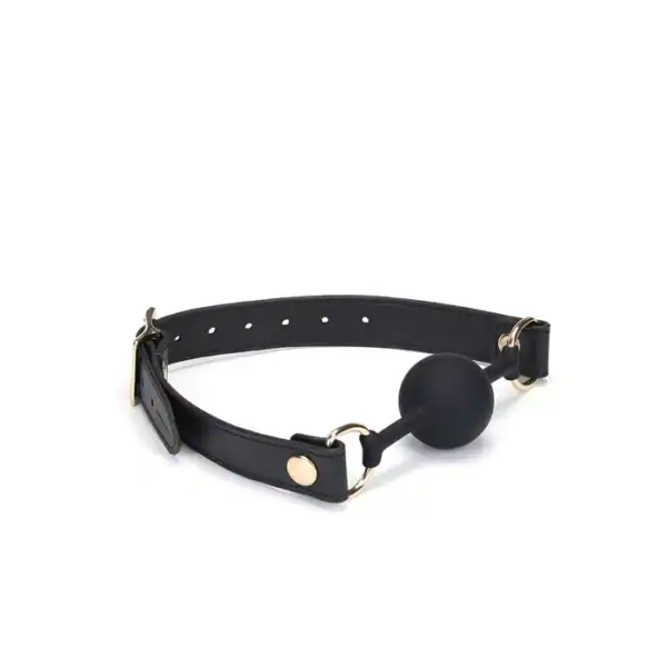 Bâillon Boule GAG en Cuir noir lisse avec boule en silicone sangle réglable détail en métal Doré
