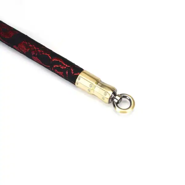 50 cm spacer bar in red imitation leather covered with black lace with gold metal details and fasteners