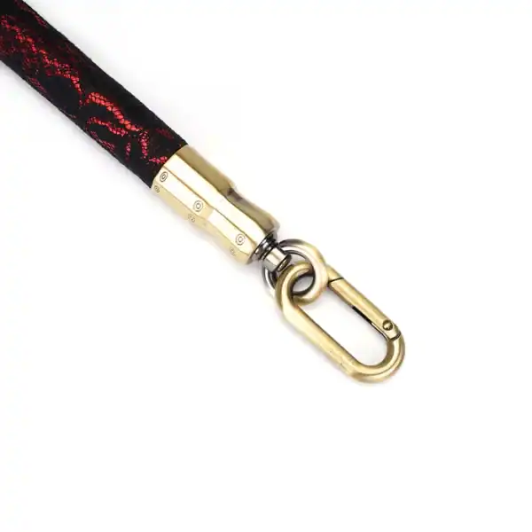 50 cm spacer bar in red imitation leather covered with black lace with gold metal details and fasteners