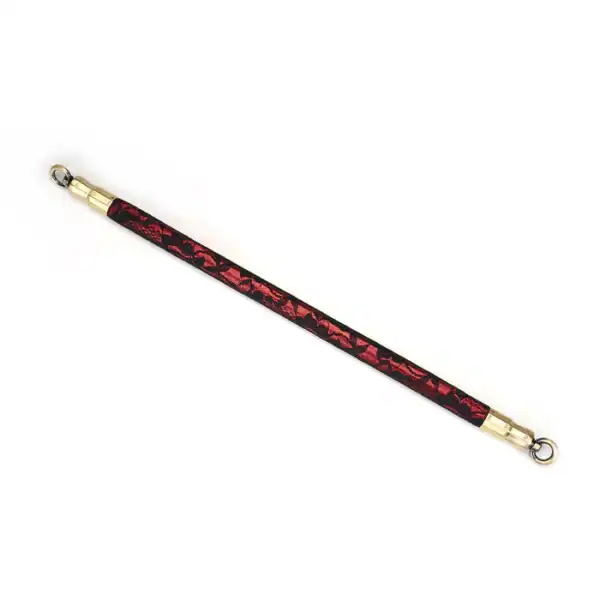 50 cm spacer bar in red imitation leather covered with black lace with gold metal details and fasteners