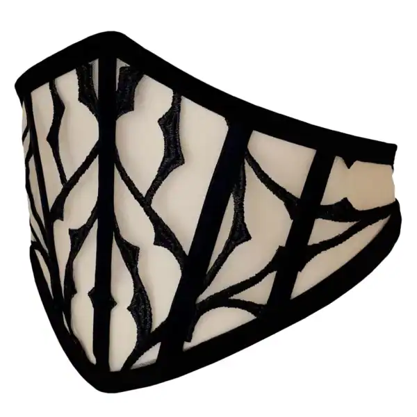 Corset belt in nude tulle with black embroidery, sculpting pointed cut. Velvet details and whalebone structure. Refined silhouette with a refined gothic touch.