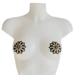 Self-adhesive nipple covers with glittery black gothic rosette motif on nude base. Soft, flexible and reusable. Elegant lingerie accessory from the DOGMA collection.