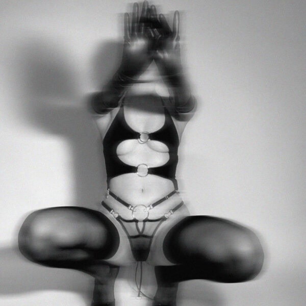 Stretch jersey lingerie combining softness and provocation. Open cut with silver metal rings, picot elastic, back tie and adjustable straps for a personalized fit.